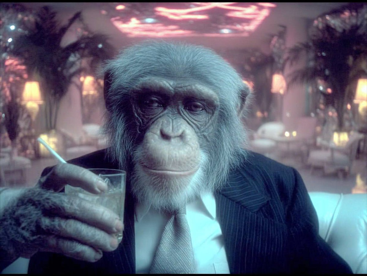 Monkey in a suit holding a drink in a pink neon lounge